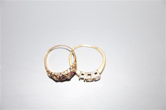 An early 20th century yellow metal, ruby? and diamond chip set ring and a modern 18ct gold and two(ex 3) stone diamond ring.